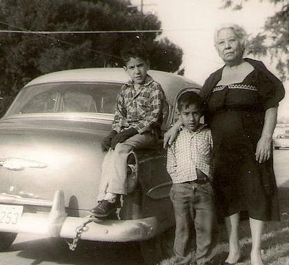 Julio and John with Aunt Andrea in front of house on Main Street, San Antonio, TX in 1958